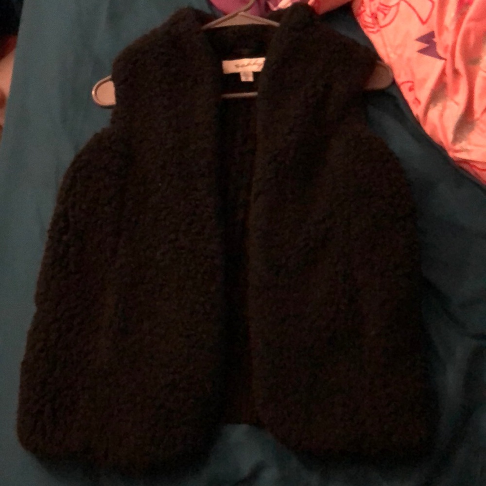 I'm selling a black faux fur vest